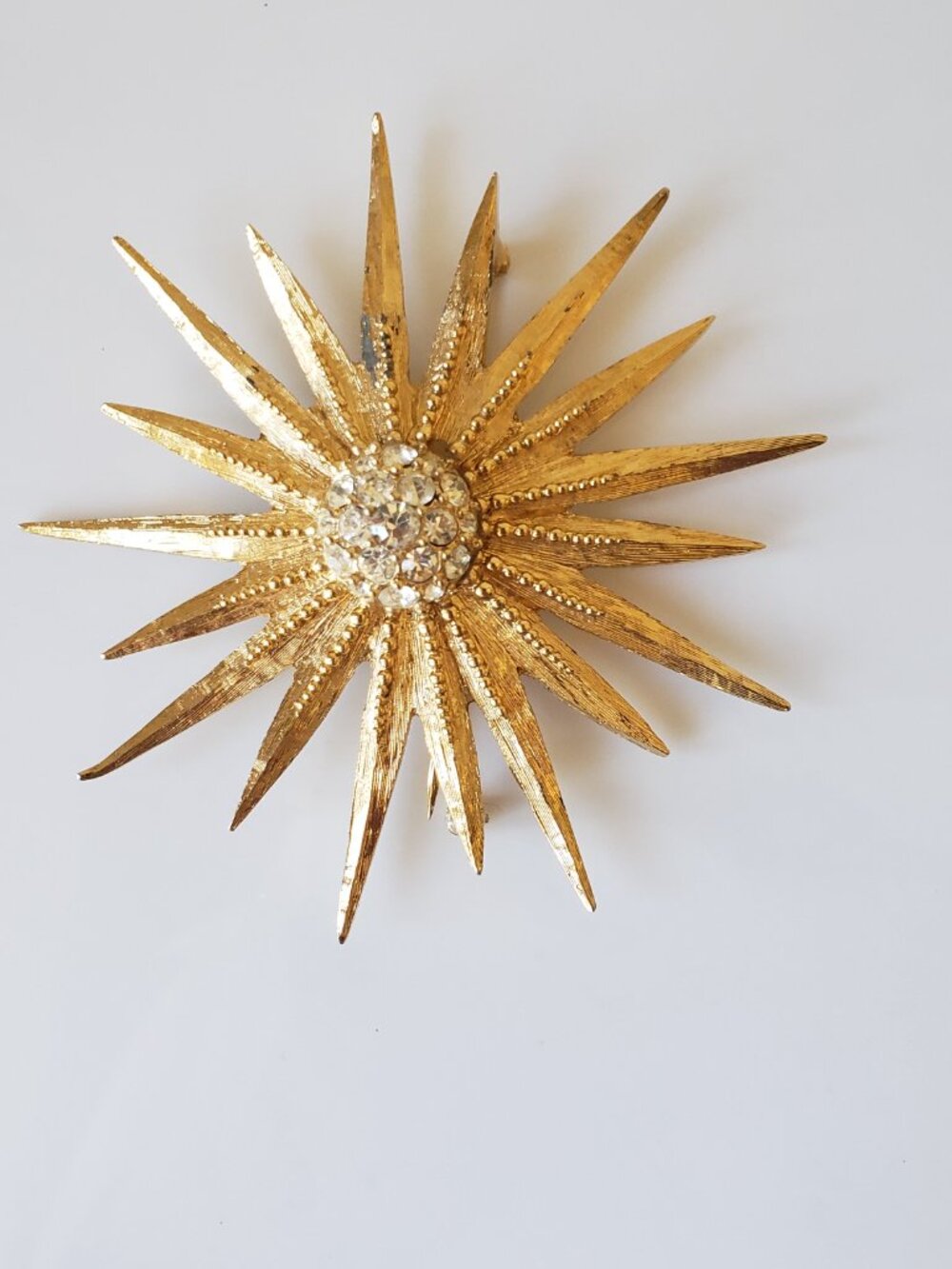 Vintage Goldtone Sunburst Brooch with Rhinestone Centre